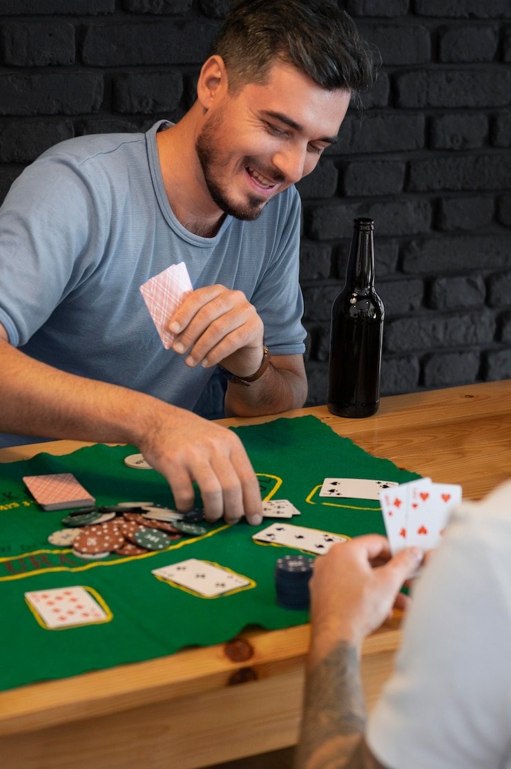 Smartphone screen showing JILI baccarat table interface with betting buttons and croupier video feed